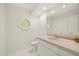 Charming half-bathroom with octagon window and decorative accents at 2886 Green Meadow Ct, Clearwater, FL 33761