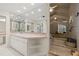 Well-lit bathroom with double sinks, a jacuzzi tub, and a glass block shower at 2886 Green Meadow Ct, Clearwater, FL 33761