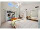 Bedroom featuring sliding glass doors to a pool and mirrored closet at 2886 Green Meadow Ct, Clearwater, FL 33761