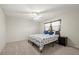 Cozy bedroom with ceiling fan, soft carpet, and a window for natural light at 2886 Green Meadow Ct, Clearwater, FL 33761