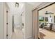 Hallway leading to an outdoor lounge area with comfortable seating and a ceiling fan at 2886 Green Meadow Ct, Clearwater, FL 33761