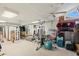 Spacious home gym with ceiling fan, natural light, and weight training equipment at 2886 Green Meadow Ct, Clearwater, FL 33761