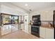 Bright kitchen featuring granite counters, modern appliances, and ample natural light at 2886 Green Meadow Ct, Clearwater, FL 33761