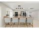 Spacious kitchen with breakfast bar, stainless steel appliances, and stylish pendant lighting at 2886 Green Meadow Ct, Clearwater, FL 33761