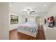 Spacious main bedroom with large mirror wall and wood flooring at 2886 Green Meadow Ct, Clearwater, FL 33761