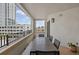 Spacious condo balcony featuring an outdoor dining set and stunning city views at 300 Beach Ne Dr # 401, St Petersburg, FL 33701