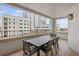 Spacious balcony showing outdoor dining, tile flooring and views of nearby building at 300 Beach Ne Dr # 401, St Petersburg, FL 33701