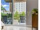 Cozy balcony with outdoor seating and views of lush landscaping and neighboring buildings at 300 Beach Ne Dr # 401, St Petersburg, FL 33701