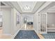 Beautiful entryway featuring travertine floors, tray ceilings and view into living area at 300 Beach Ne Dr # 401, St Petersburg, FL 33701