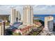Upscale condo building showcasing waterfront views, mature landscaping, and beautiful red tile roofs at 300 Beach Ne Dr # 401, St Petersburg, FL 33701