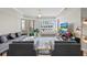 Cozy living room with modern furniture, a TV, and plenty of natural light at 300 Beach Ne Dr # 401, St Petersburg, FL 33701