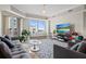 Bright living room featuring neutral decor, comfortable seating, and a sliding door to the outside at 300 Beach Ne Dr # 401, St Petersburg, FL 33701