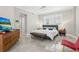 Comfortable main bedroom features plantation shutters, sitting area, and plenty of natural light at 300 Beach Ne Dr # 401, St Petersburg, FL 33701