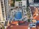 Aerial view of the outdoor pool surrounded by lush landscaping and seating areas at 300 Beach Ne Dr # 401, St Petersburg, FL 33701