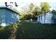 View of the spacious backyard with a shed and plenty of room to play at 3421 E Powhatan Ave, Tampa, FL 33610