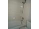Bathroom with shower over tub and tiled walls at 3421 E Powhatan Ave, Tampa, FL 33610