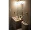 Well-lit bathroom featuring a vanity with a sink and a mirror at 3421 E Powhatan Ave, Tampa, FL 33610
