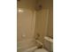 Bathroom with shower over tub and tiled walls at 3421 E Powhatan Ave, Tampa, FL 33610