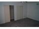 Bedroom with closets and carpeted floor at 3421 E Powhatan Ave, Tampa, FL 33610