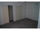 Bedroom with closets and carpeted floor at 3421 E Powhatan Ave, Tampa, FL 33610