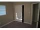 This bedroom has carpeted floors and a closet for convenient storage solutions at 3421 E Powhatan Ave, Tampa, FL 33610