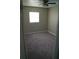 This bedroom has carpeted floors and a window for lots of natural light at 3421 E Powhatan Ave, Tampa, FL 33610