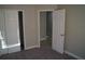 A bedroom with carpeted floors and closets that are great for storage at 3421 E Powhatan Ave, Tampa, FL 33610