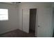 This bedroom has carpeted floors and a closet for convenient storage solutions at 3421 E Powhatan Ave, Tampa, FL 33610