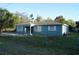 Cozy home with a fenced yard, providing both privacy and a sense of security at 3421 E Powhatan Ave, Tampa, FL 33610