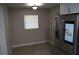 Kitchen with a stainless steel refrigerator and a bright, sunlit window at 3421 E Powhatan Ave, Tampa, FL 33610