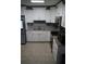 Well-equipped kitchen featuring updated cabinets, granite counters and modern appliances at 3421 E Powhatan Ave, Tampa, FL 33610