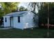 Outdoor shed with a small awning offering functional backyard storage at 3421 E Powhatan Ave, Tampa, FL 33610