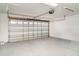 Spacious garage with an automatic door and concrete floor at 406 S Pebble Beach Blvd, Sun City Center, FL 33573