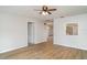 Cozy living room with wood floors and view into the kitchen at 406 S Pebble Beach Blvd, Sun City Center, FL 33573
