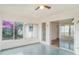 Sunroom with many windows and slider, providing lots of natural light at 406 S Pebble Beach Blvd, Sun City Center, FL 33573