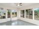 Sunroom with many windows that provides views of the landscape at 406 S Pebble Beach Blvd, Sun City Center, FL 33573