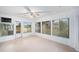 Bright sunroom with multiple windows offering backyard views at 406 S Pebble Beach Blvd, Sun City Center, FL 33573