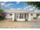 Enclosed sunroom with windows and views of the backyard at 406 S Pebble Beach Blvd, Sun City Center, FL 33573