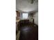 Incomplete kitchen featuring rustic wood countertops, aged wood cabinets, and a single-basin sink with a window view at 4207 E Henry Ave, Tampa, FL 33610
