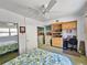 Cozy bedroom featuring a floral comforter, mirrored closet doors, and built-in shelves at 504 67Th Ave # 4, St Pete Beach, FL 33706