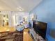 Bright living room featuring hardwood floors, comfortable seating, and views into other rooms at 504 67Th Ave # 4, St Pete Beach, FL 33706