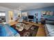 Cozy living room featuring an area rug, comfortable seating, and hardwood floors at 504 67Th Ave # 4, St Pete Beach, FL 33706