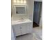 Bathroom vanity with white cabinet, solid surface countertop, and brushed metal fixtures at 5401 Locklear Pl, Riverview, FL 33578