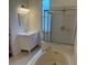 Relaxing bathroom featuring a soaking tub, glass-enclosed shower, and modern vanity at 5401 Locklear Pl, Riverview, FL 33578