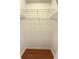 Walk-in closet features white walls and wood floor, with wire shelving and hanging rods at 5401 Locklear Pl, Riverview, FL 33578