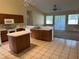 Functional kitchen featuring an island, ample cabinet space, and modern appliances at 5401 Locklear Pl, Riverview, FL 33578