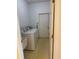 Functional laundry room with washer, dryer, wash tub and direct access to backyard at 5401 Locklear Pl, Riverview, FL 33578