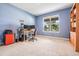 Home office with a large window and a built-in bookcase at 5416 Camberwell Ln, Riverview, FL 33578