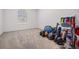 Unfurnished bedroom being used for storage with a window for natural light at 5416 Camberwell Ln, Riverview, FL 33578