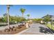 Gated community entrance with meticulously landscaped areas and decorative brick paved road at 5416 Camberwell Ln, Riverview, FL 33578